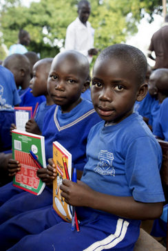 two boys holding up books