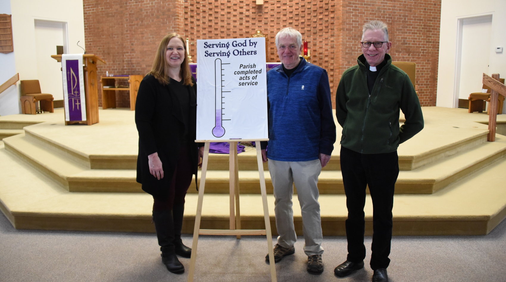 Kim Suttie, Bill Wood, and Father Dan Baillargeon