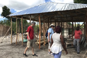 Sister with others at new building