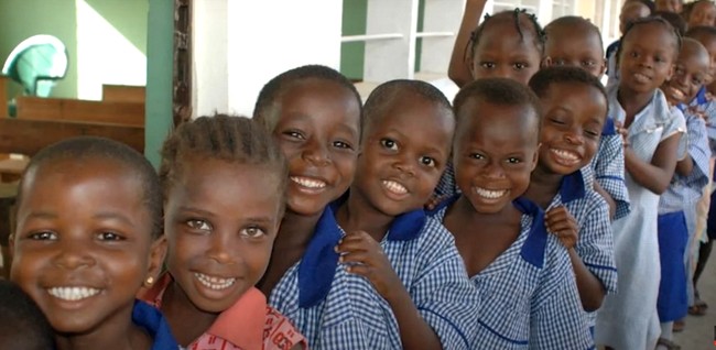 little boys in a row smiling 