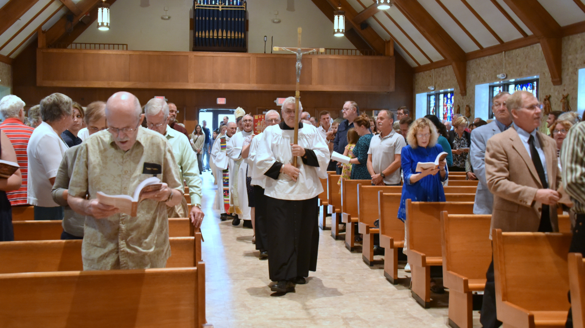 The opening procession of the 100th anniversary Mass at St. Rose of Lima Church in Jay, Maine.