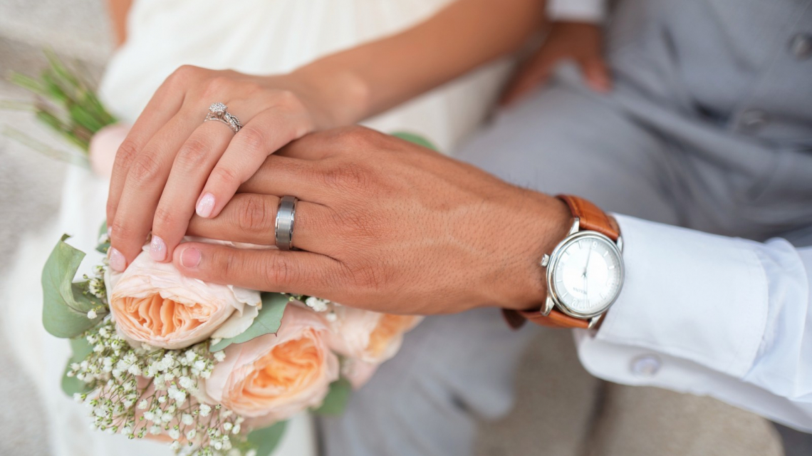 Hands of married couple