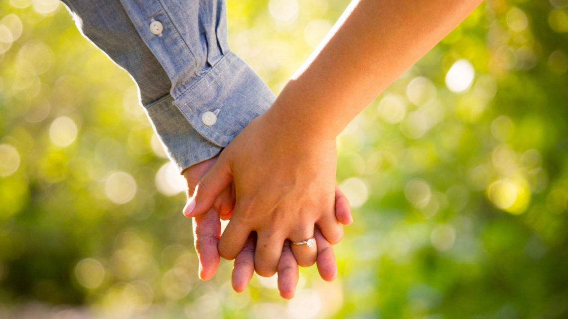 Couple holding hands