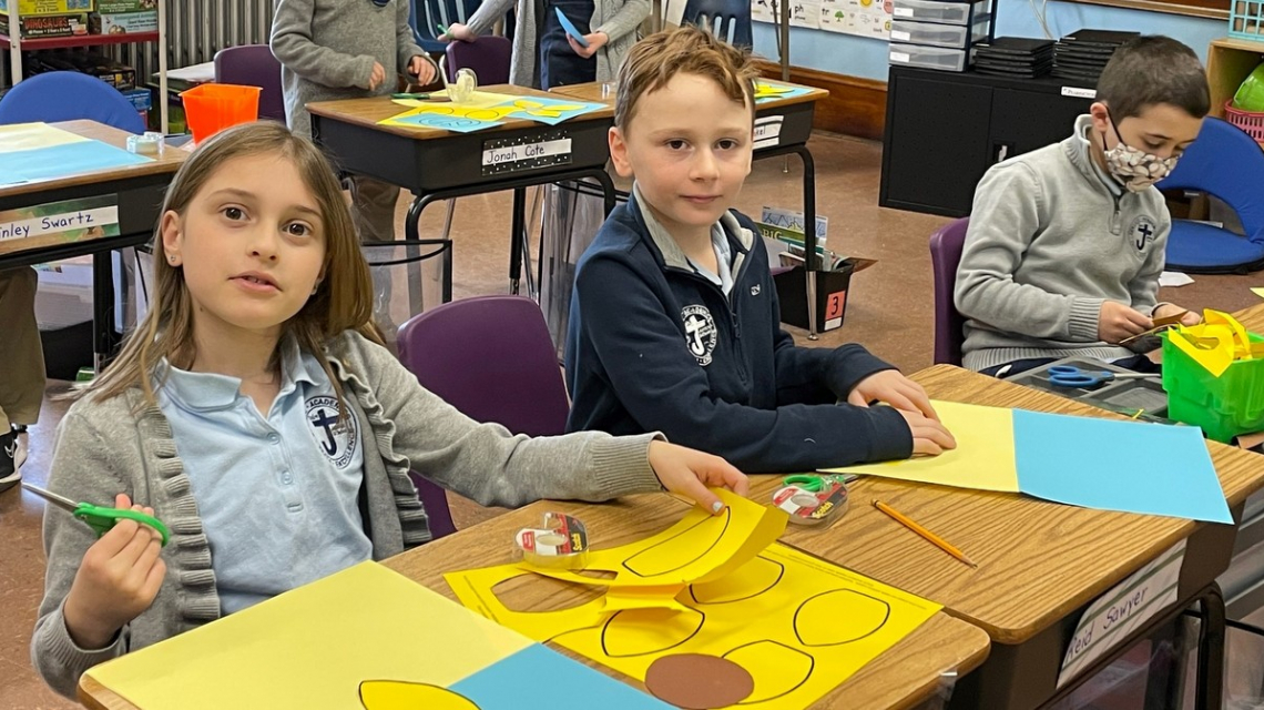 St. James students cut out sunflower petals.