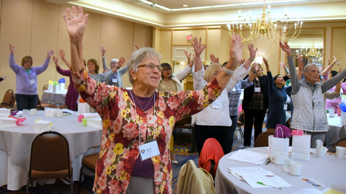 Women with raised hands