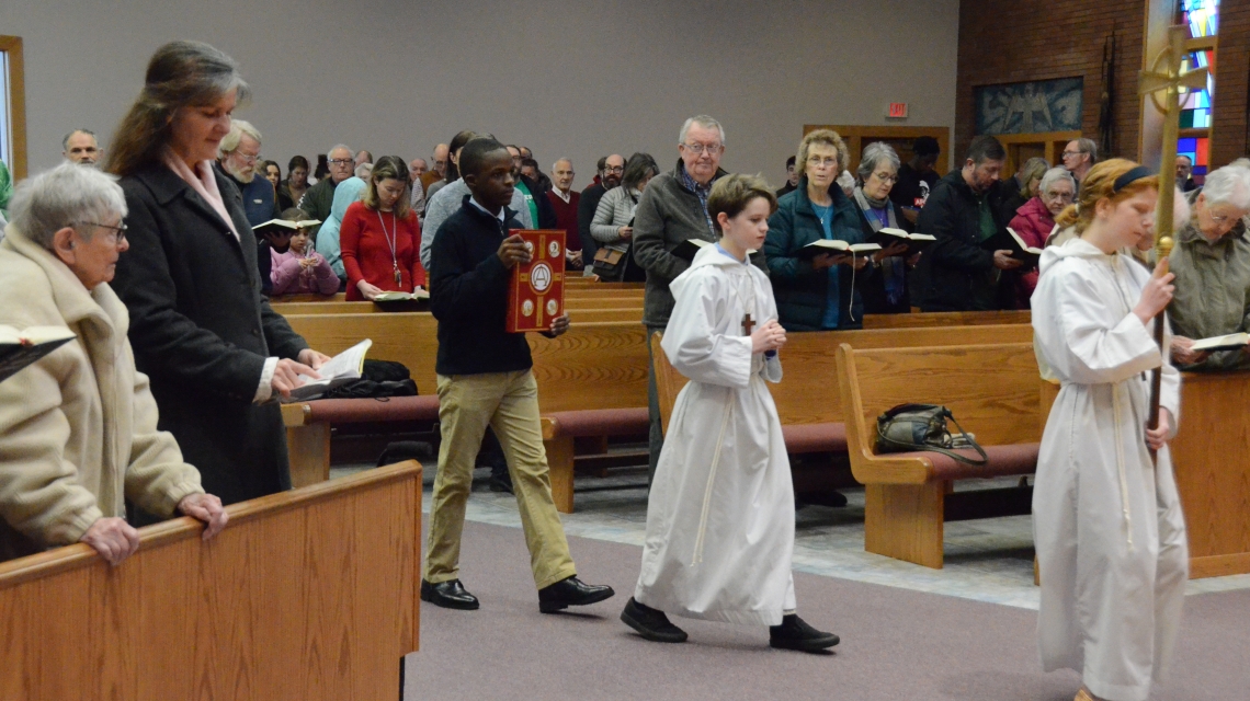 students process at Mass