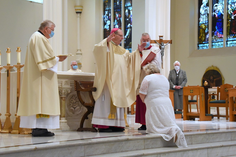 Bishop Robert Deeley prays the Prayer of Consecration.