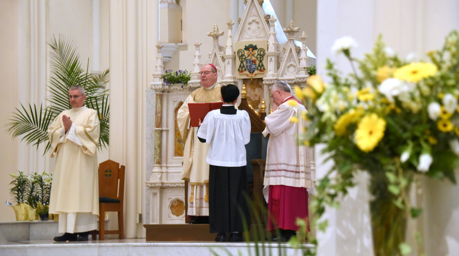 Bishop Robert Deeley begins the Mass.