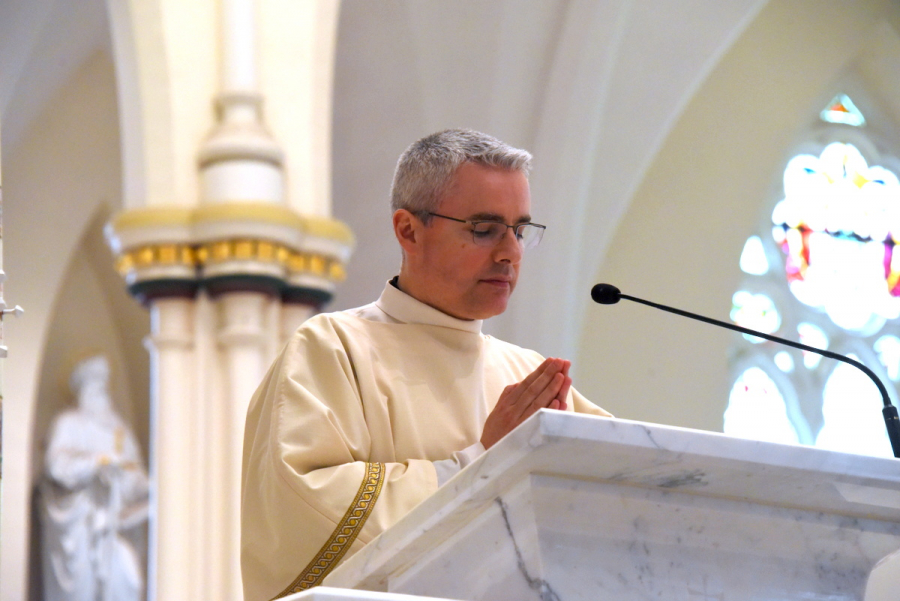 Deacon Luis Sanclemente reads the Gospel.