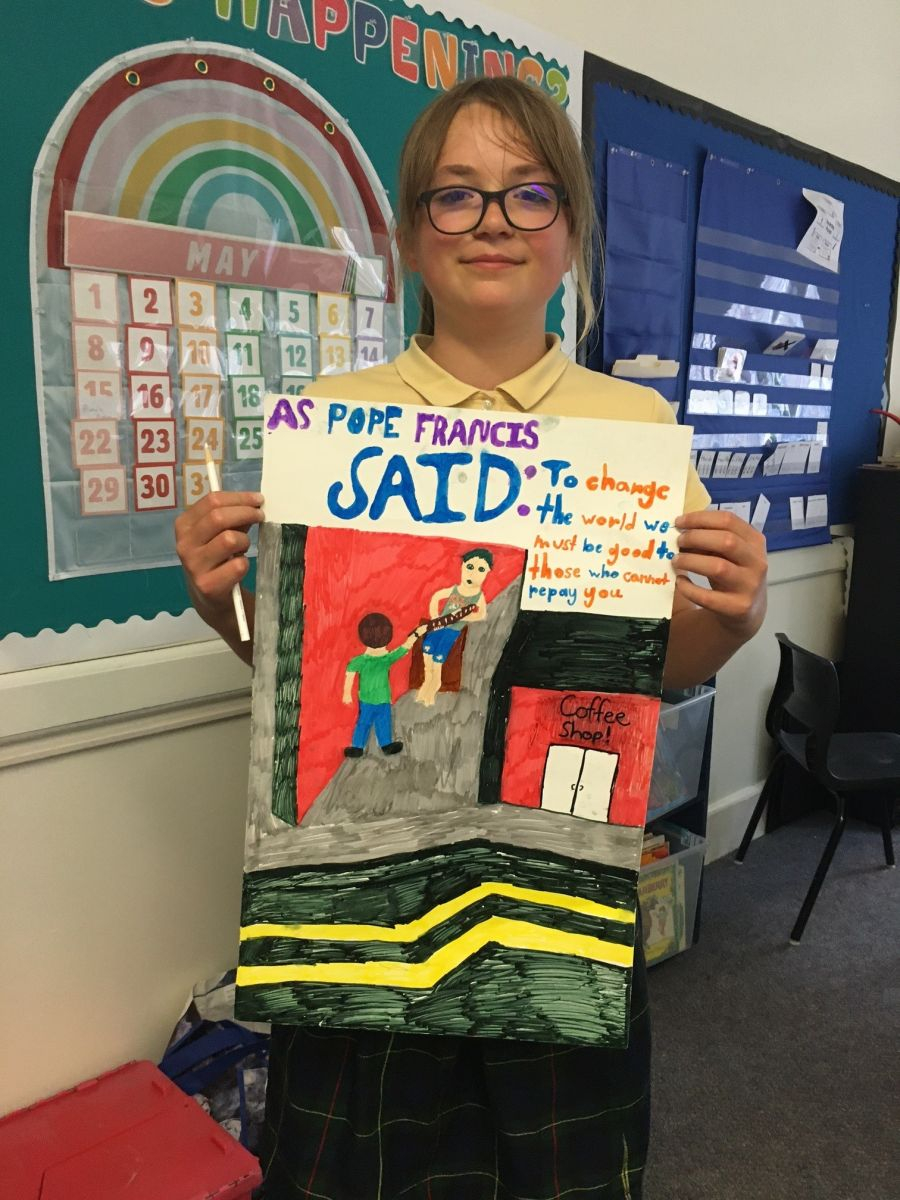 Teen holding up a poster