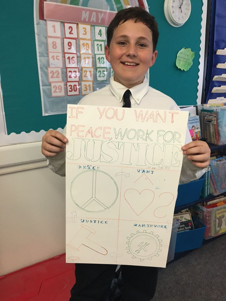 Teen holding up a poster