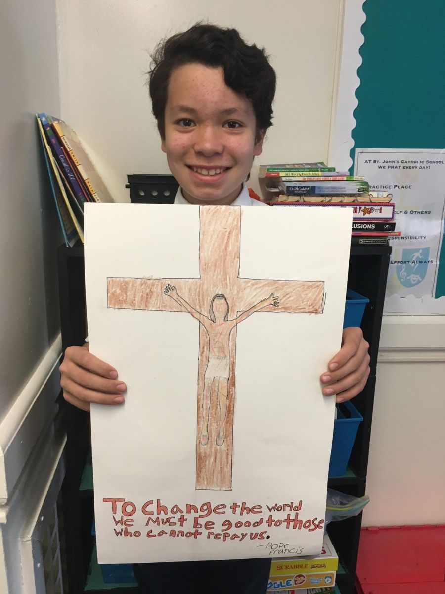 Teen holding up a poster