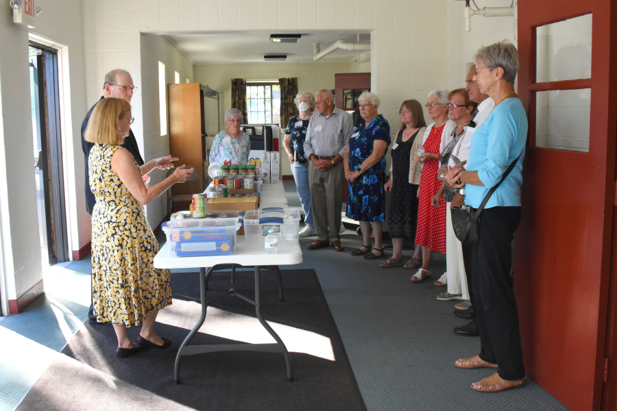 Bishop Deeley with Barbara Russell and volunteers