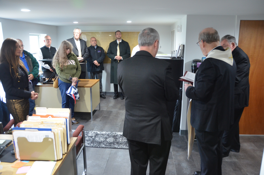 Bishop Deeley blesses the new office at St. Joseph Cemetery in Biddeford. 