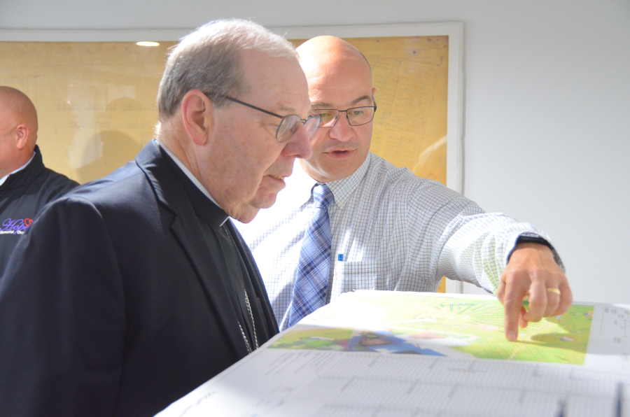 Bishop Deeley blesses the new office at St. Joseph Cemetery in Biddeford. 