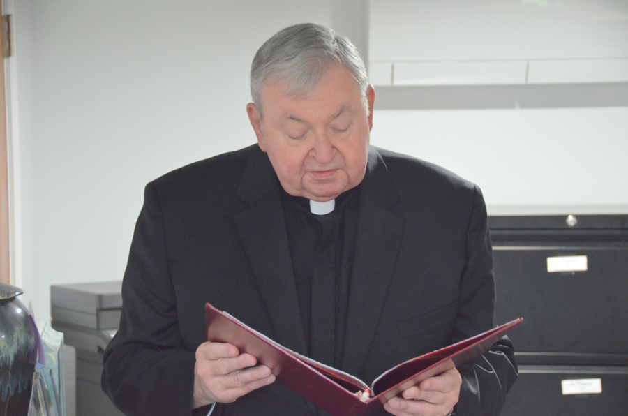 Bishop Deeley blesses the new office at St. Joseph Cemetery in Biddeford. 