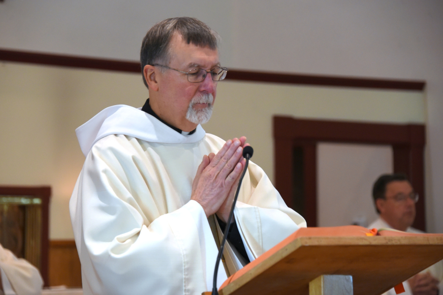 Deacon Peter Bernier delivers the Gospel.