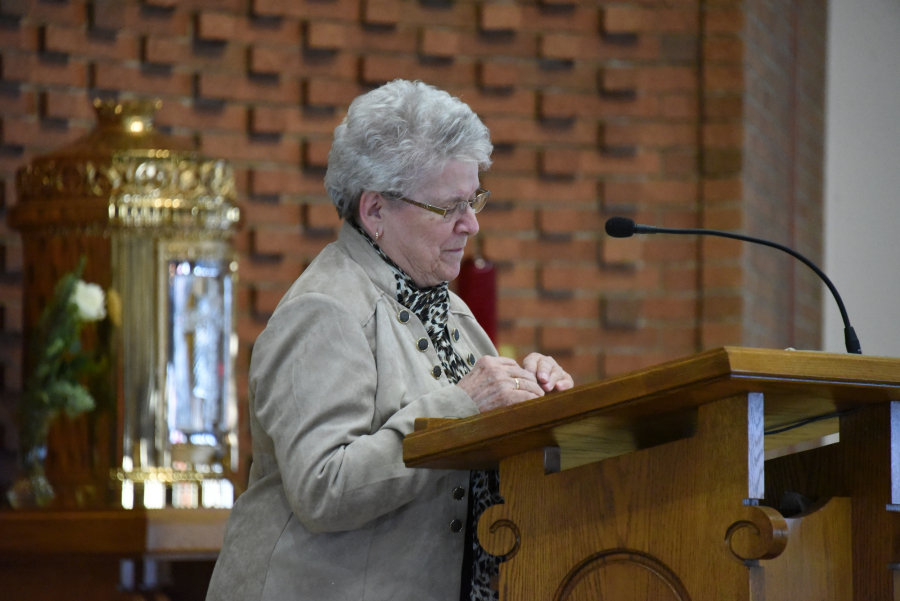 Jeannine DeRosby reads at Mass a Notre Dame Church in Waterville