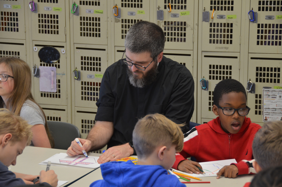 Bishop Deeley visits St. Dom's Lewiston campus during Maine Catholic Schools Week. 