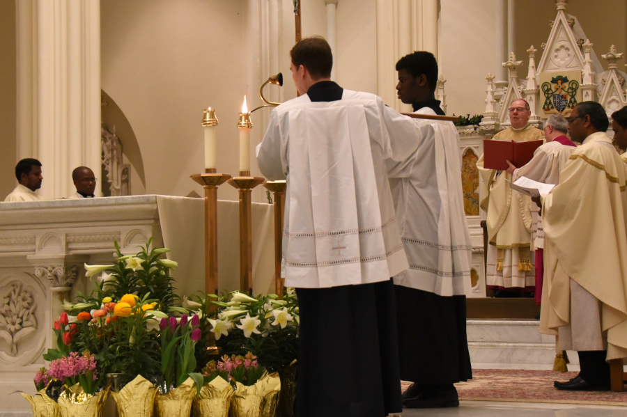 Lighting the candles on the altar