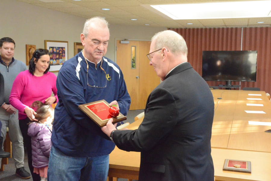 Bishop Deeley presents William Ridge with the Teacher of the Year Award.