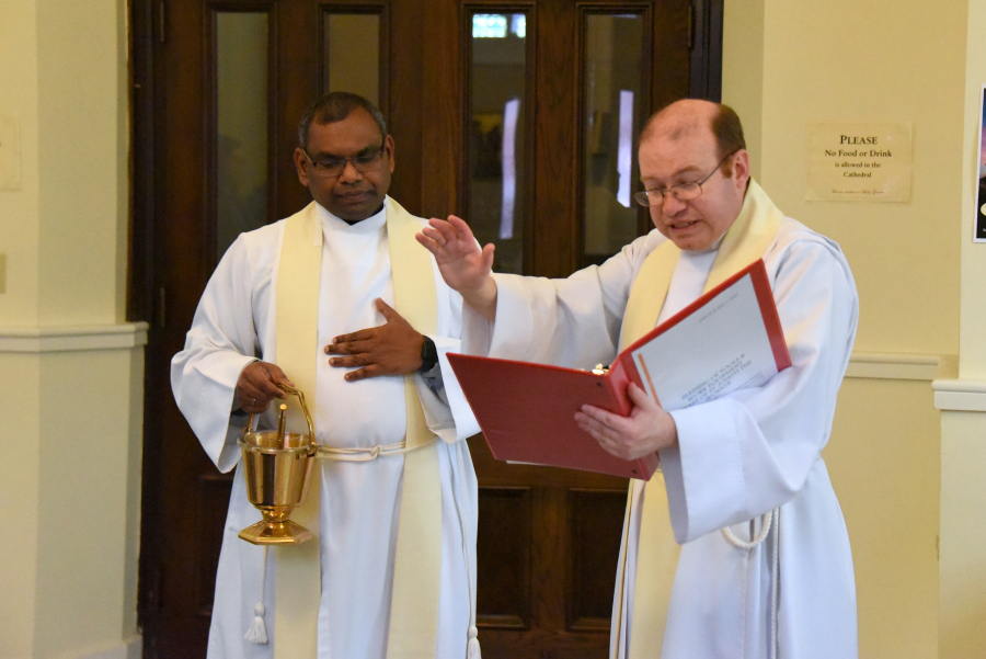 Father Kevin Upham blesses the tools.