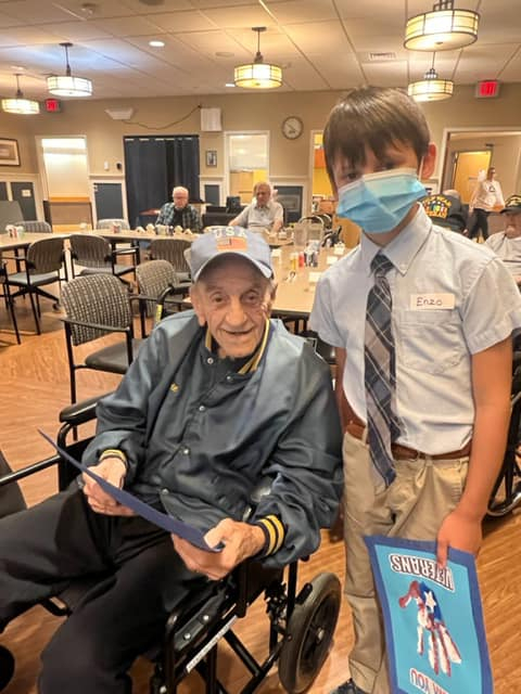 Holy Cross students in South Portland meet their veteran pen pals. 