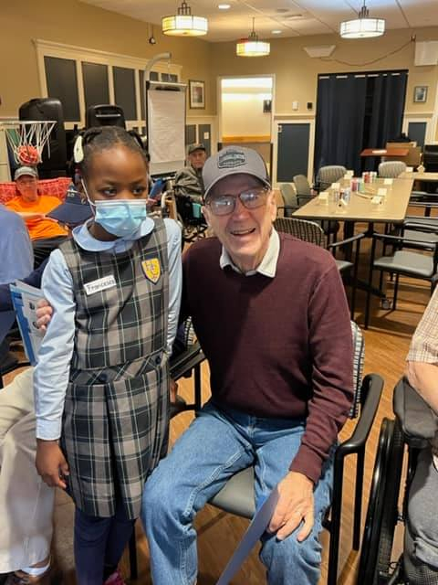 Holy Cross students in South Portland meet their veteran pen pals. 