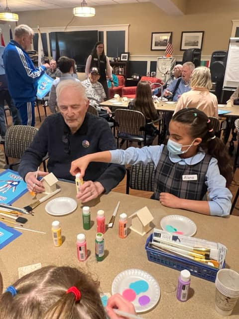 Holy Cross students in South Portland meet their veteran pen pals. 