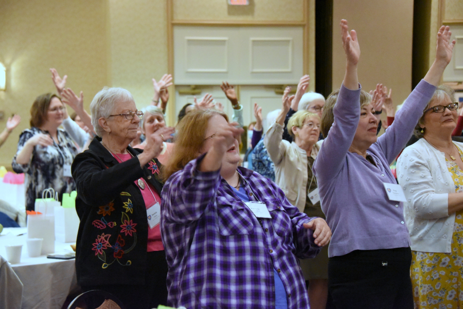 Women with raised hands