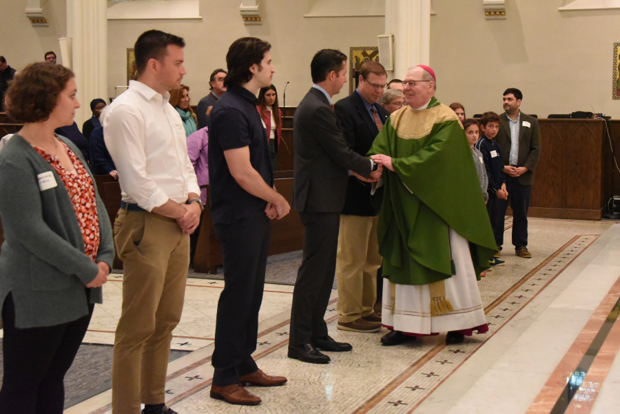 The Neophytes receive a greeting from the bishop.