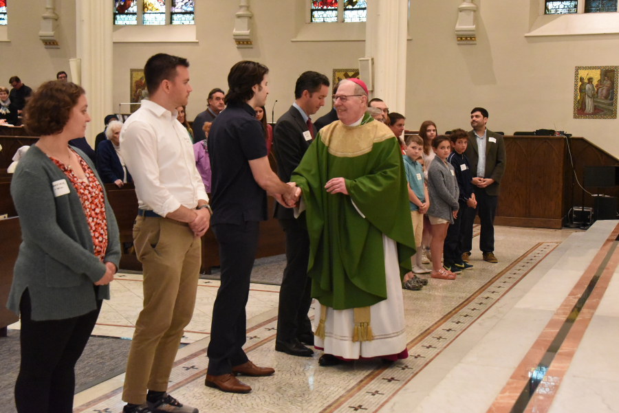 The Neophytes receive a greeting from the bishop.