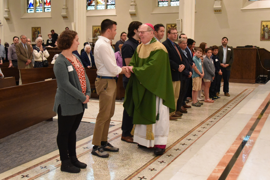 The Neophytes receive a greeting from the bishop.