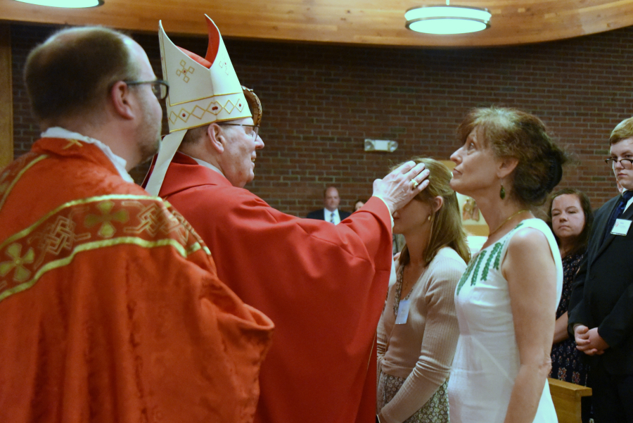 Receiving the sacrament of confirmation