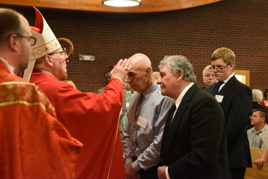 Receiving the sacrament of confirmation