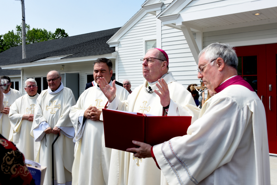 Bishop Deeley begins the Mass outside the church