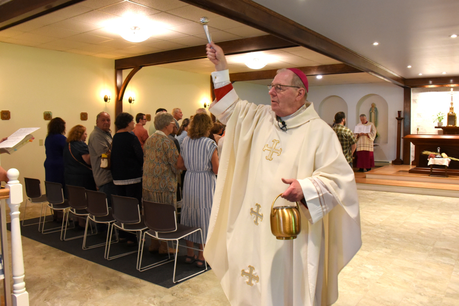 Bishop Deeley blesses the church and the congregation.
