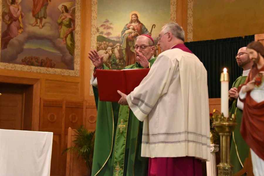 Bishop Deeley blesses the couples.