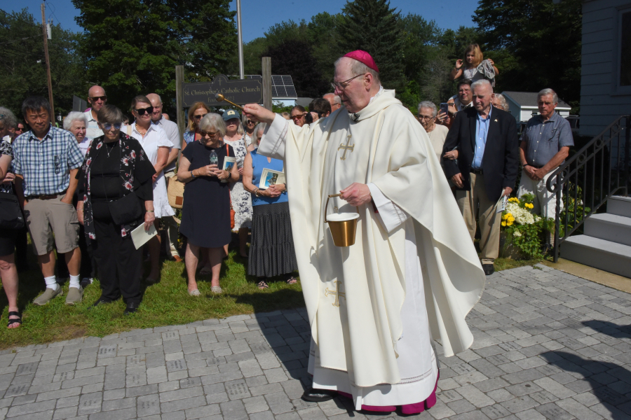 Bishop Robert Deeley blesses the pavers.