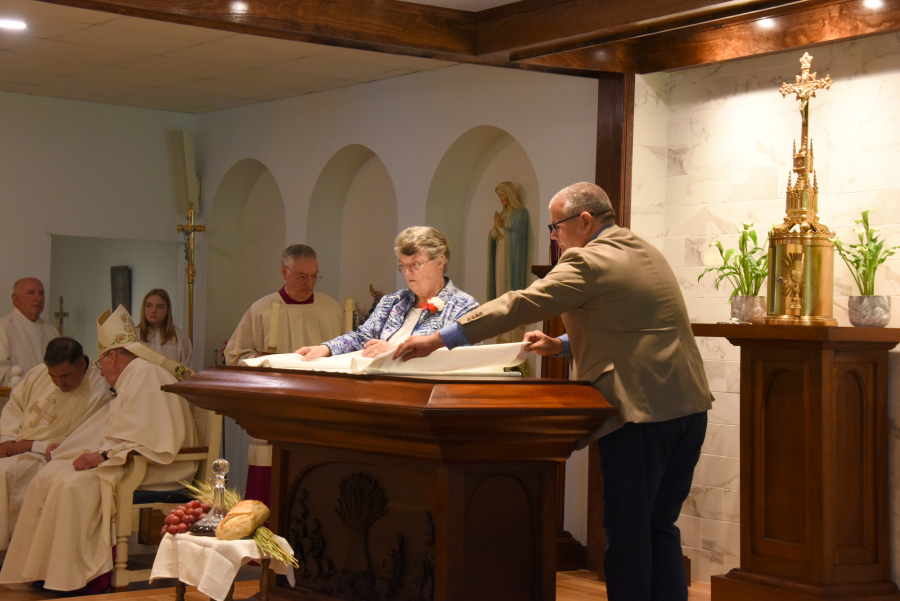 Dressing the altar with an altar cloth.