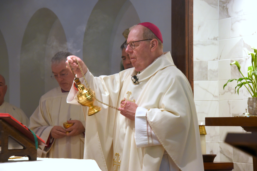 Bishop Robert Deeley incenses the church.