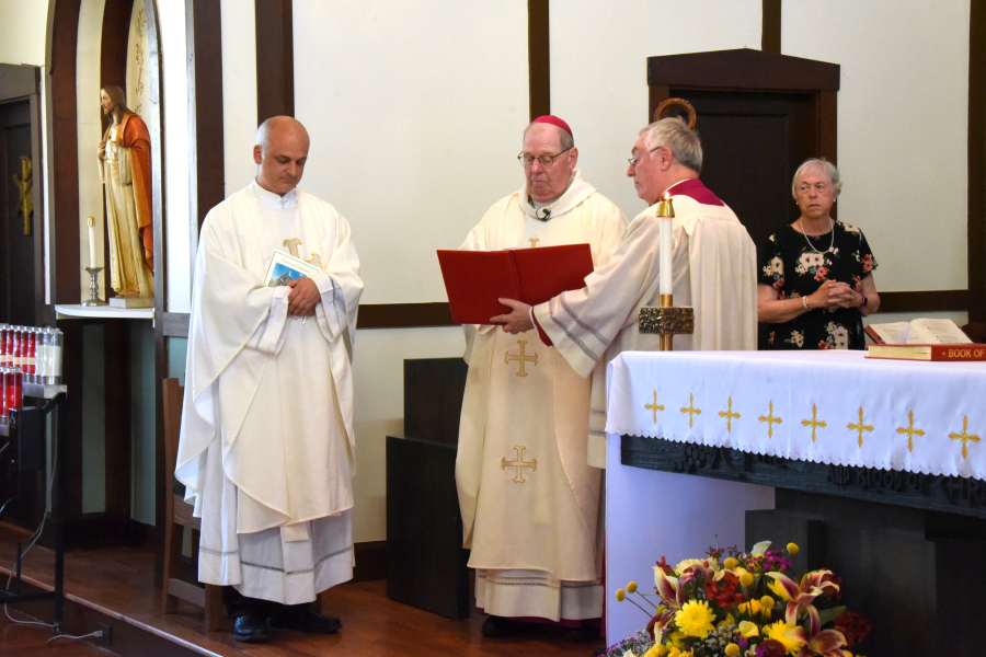 Bishop Robert Deeley gives the opening blessing.