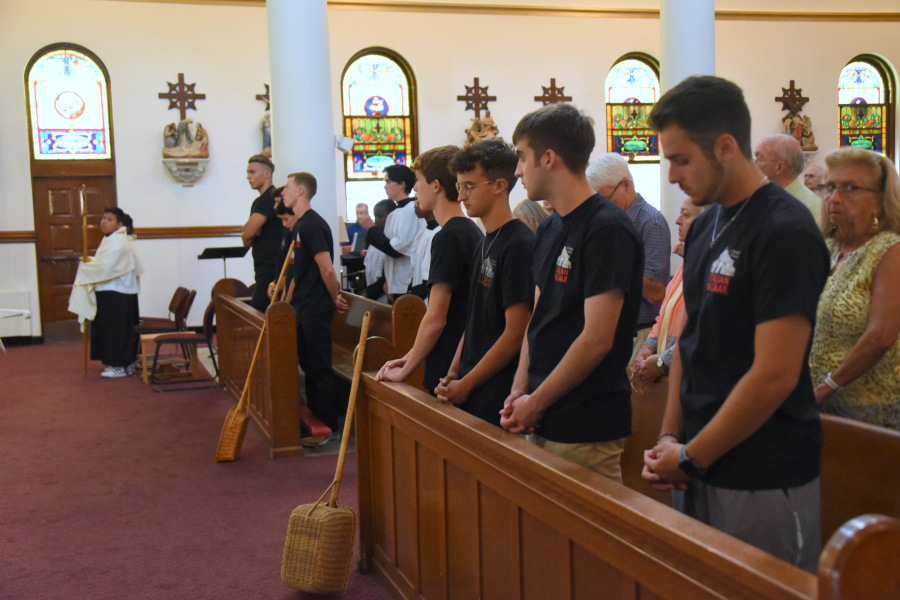 Young men who will be carrying the statues