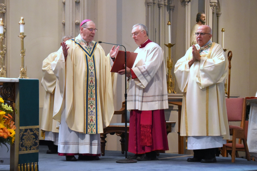 The bishop praying