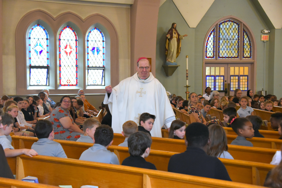 Bishop Deeley talks with students.