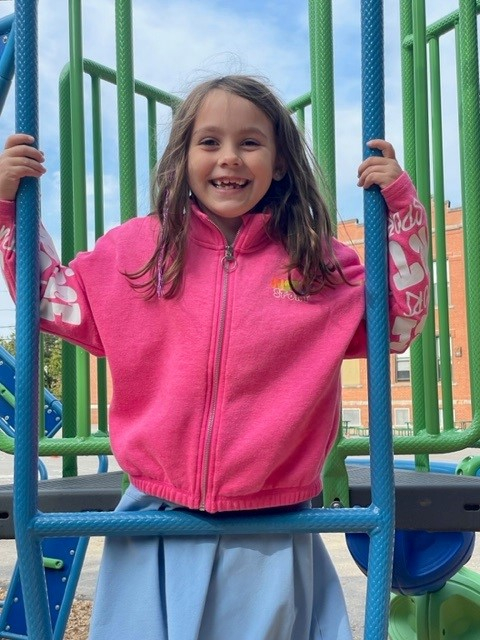 Student on playground equipment