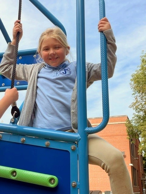 Student on playground equipment