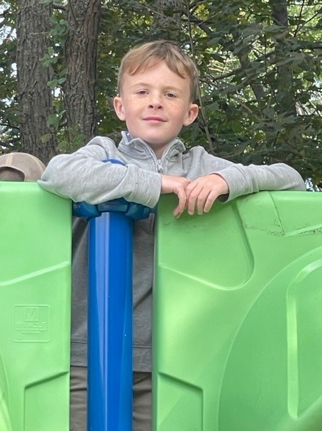 Student on playground equipment