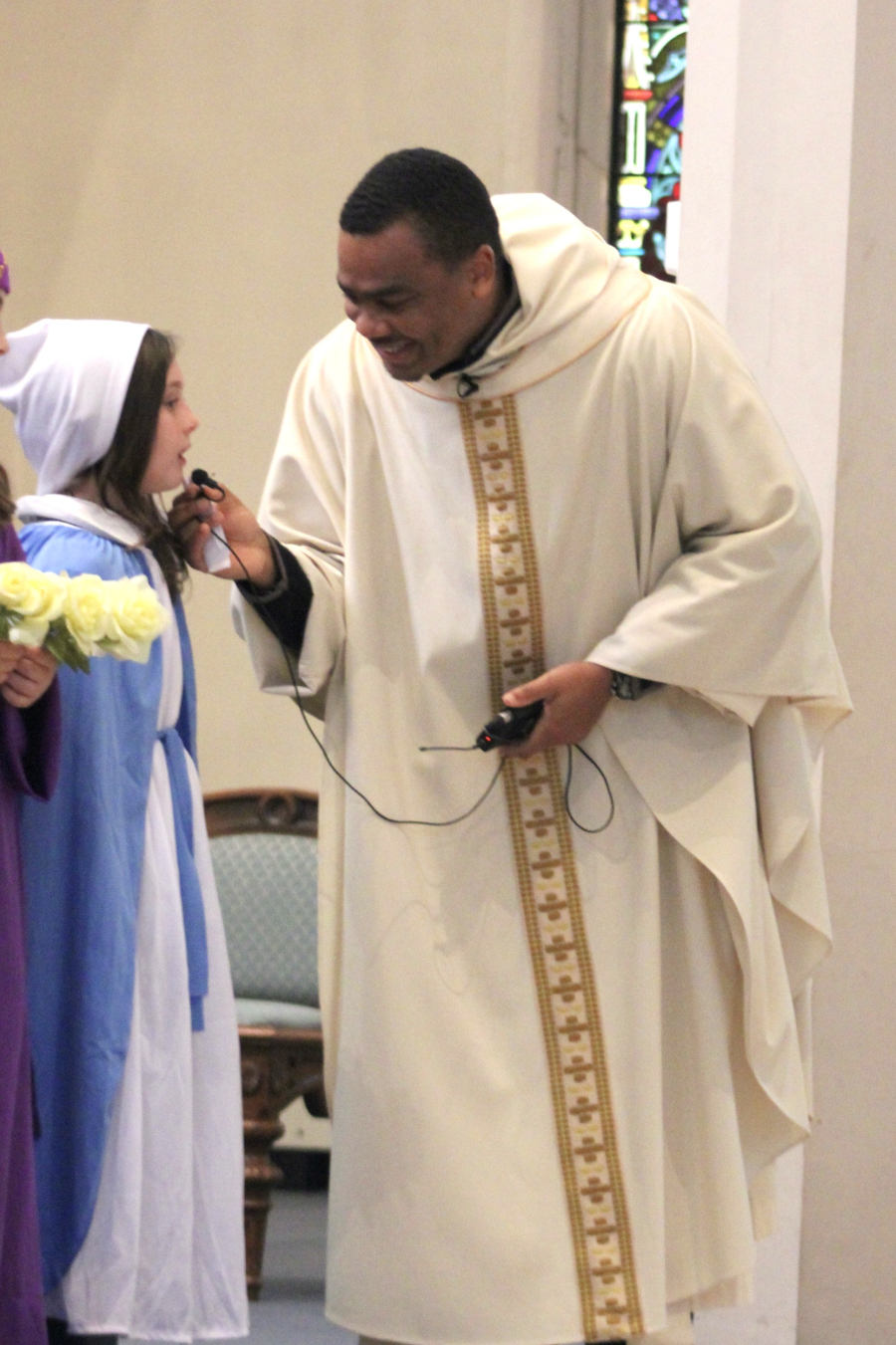 Father Joseph Osunde with one of the third graders