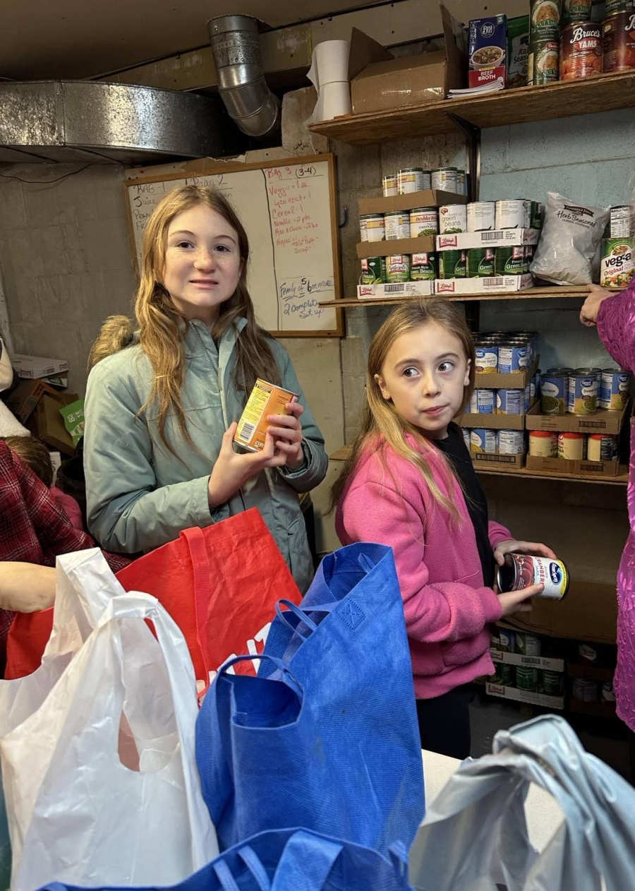 Children with cans of food